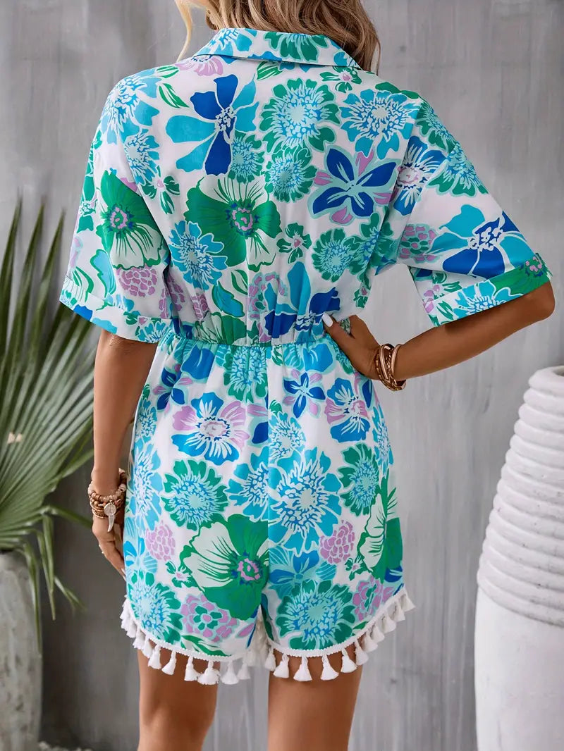 Zomerse jumpsuit met exotische all-over bloemenprint, tailleband, knoopsluiting en een kraag